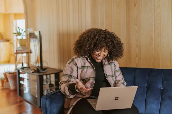 woman-on-call-on-laptop.jpg