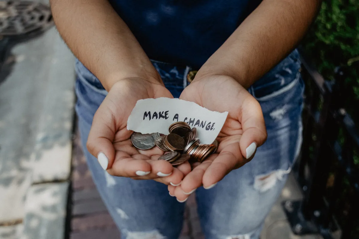 kat-yukawa-woman-holding-coins-unsplash.jpg