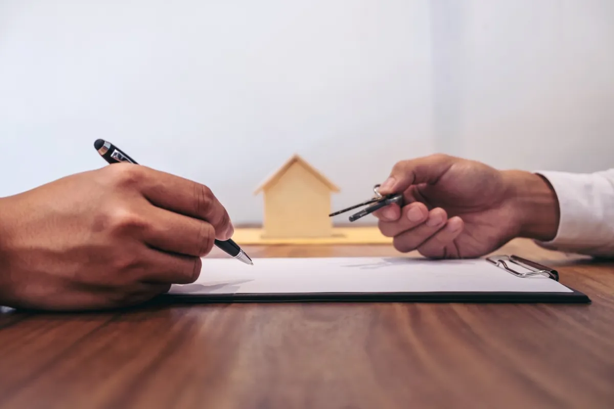 man-signing-contract-of-loan-agreement-document-with-bank-broker-agent-insurance-real-estate-concept_t20_ooLrZ3.jpg