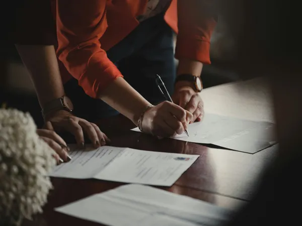 person-signing-documents.jpg