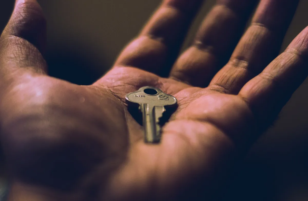 cmdr-shane-hand-holding-key-unsplash.jpg